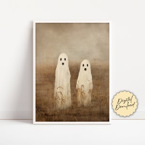 May include: Two white ghosts with open mouths and large eyes stand in a field of tall, brown grass. The background is a hazy brown colour.