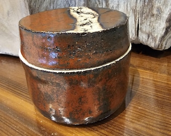 Hand thrown pottery canister with lid ancient copper glaze adorned lid