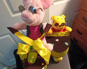 Motorcycle with side car diaper cake with wennie the Pooh and piglet too.