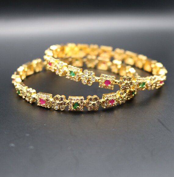Gold bangles with stones designs store