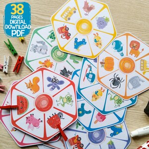 Puede incluir: Un conjunto de 38 p&aacute;ginas imprimibles con tableros de juego ilustrados y coloridos con varios animales, insectos y objetos. Cada tablero tiene un spinner circular en el centro. Los tableros est&aacute;n dise&ntilde;ados para un juego de coincidencia.
