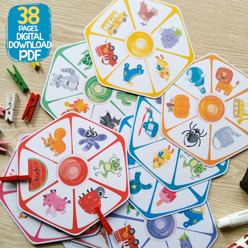 May include: A set of 38 printable pages featuring colorful, illustrated cards with various images, including a squirrel, a ladybug, a watermelon, a frog, a bat, a spider, a pumpkin, a watering can, a helicopter, a bus, a rooster, a grape, a cactus, a turtle, a shoe, a chick, a lion, a watering can, and a tractor. The cards are designed for a game or activity.