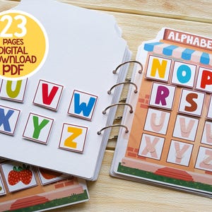 K&ouml;nnte beinhalten: Ein 23-seitiges digitales PDF-Alphabetbuch zum Herunterladen f&uuml;r Kinder. Das Buch zeigt bunte Buchstaben von N bis Z, wobei jeder Buchstabe mit einem entsprechenden Bild kombiniert wird. Das Buch soll Kindern helfen, das Alphabet zu lernen und ihre Lesef&auml;higkeiten zu verbessern.