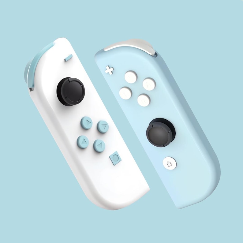 May include: Two Nintendo Switch Joy-Con controllers, one white and one light blue. The controllers feature buttons, joysticks, and a directional pad.