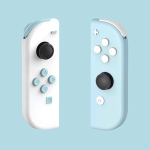May include: Two Nintendo Switch Joy-Con controllers, one white and one light blue. Both controllers have buttons and a joystick.