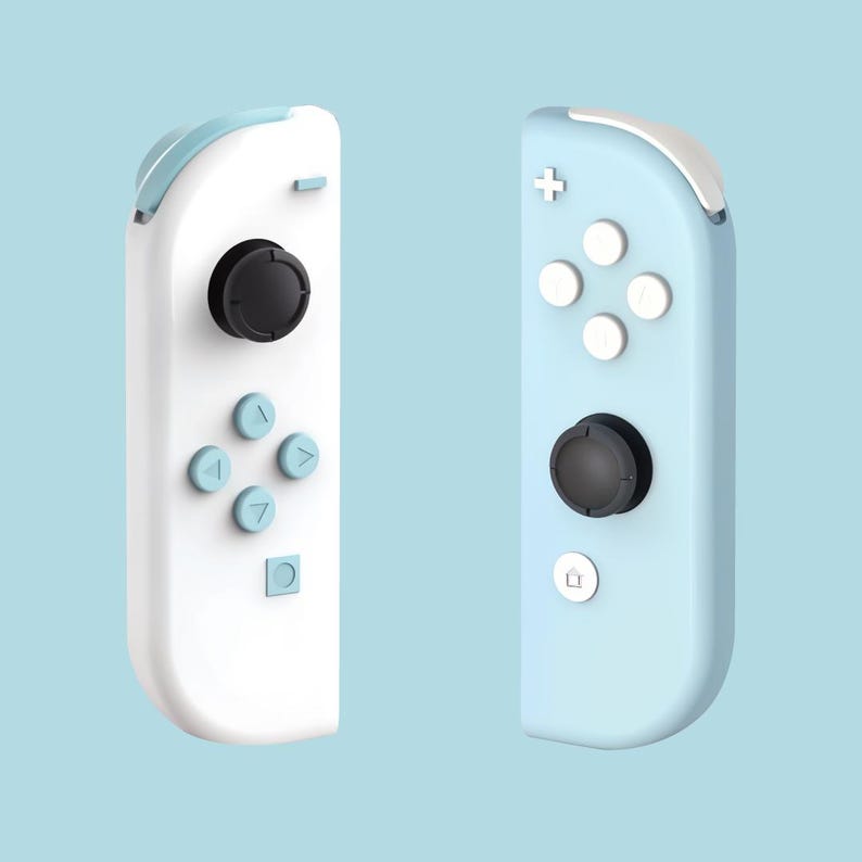 May include: Two Nintendo Switch Joy-Con controllers, one white and one light blue. Both controllers have buttons and a joystick.