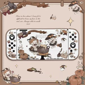 May include: A white Nintendo Switch game console skin with a Halloween theme. The design features a witch, a cauldron, and a pumpkin. The text "The Blessings of the Demon Girl" is at the top of the skin.