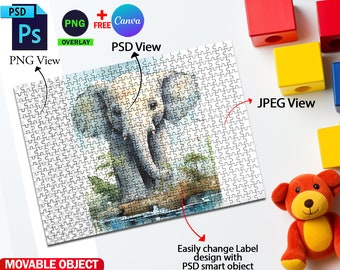 May include: A 500-piece jigsaw puzzle mockup with an elephant illustration. The puzzle is on a white surface with colorful blocks and a teddy bear. The text "500 Jigsaw Puzzle Mockup" is at the top of the image. The text "PSD View" and "PNG View" are on the left side of the image. The text "JPEG View" is on the right side of the image.