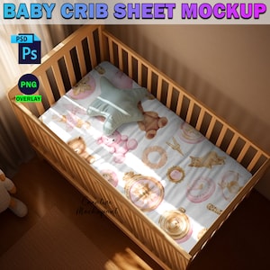 May include: A white crib sheet with a pink and gold pattern featuring teddy bears, stars, and other whimsical designs. The sheet is in a wooden crib with a white background.