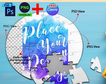 May include: A 24-piece round jigsaw puzzle mockup with a watercolor background. The puzzle pieces are arranged in a circle, with the center piece missing. The text "Place Your Design" is written on the puzzle pieces. The mockup is on a blue background.
