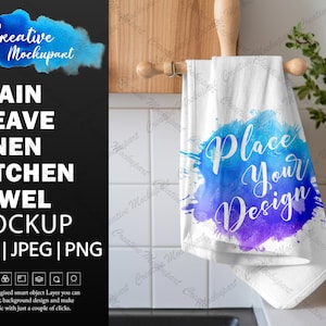 May include: White kitchen towel mockup with a blue and purple watercolor design that says "Place Your Design".