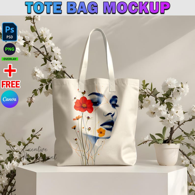 May include: White tote bag mockup with a colorful floral design featuring a woman's face and flowers. The bag has two handles and is made of canvas.