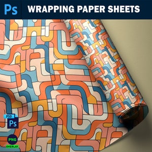 May include: A roll of wrapping paper with a geometric pattern of orange, blue, and yellow lines on a white background. The paper is rolled up and the end is visible.