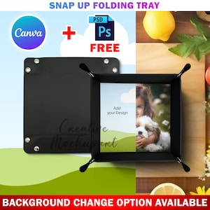 Op de afbeelding: Zwarte, opklapbare dienblad met een witte achtergrond en een foto van een meisje en een hond. De tekst "Voeg uw ontwerp toe" staat op het dienblad. Het dienblad ligt op een houten oppervlak.