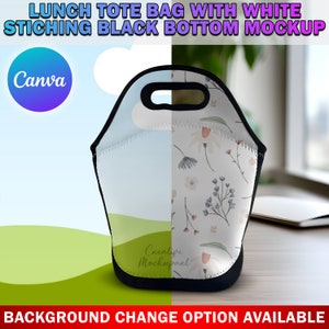 May include: A white lunch tote bag with a floral pattern on one side and a solid light blue colour on the other side. The bag has a black bottom and white stitching. The bag is sitting on a wooden surface.
