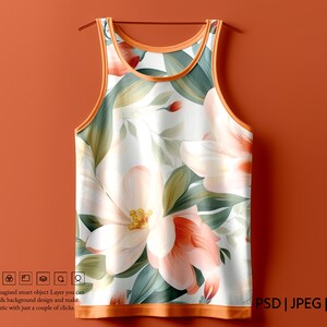 K&ouml;nnte beinhalten: Ein wei&szlig;es Tanktop mit einem Blumendruck mit gro&szlig;en rosa und wei&szlig;en Bl&uuml;ten und gr&uuml;nen Bl&auml;ttern. Das Tanktop hat einen orangefarbenen Saum an Hals und Arml&ouml;chern.