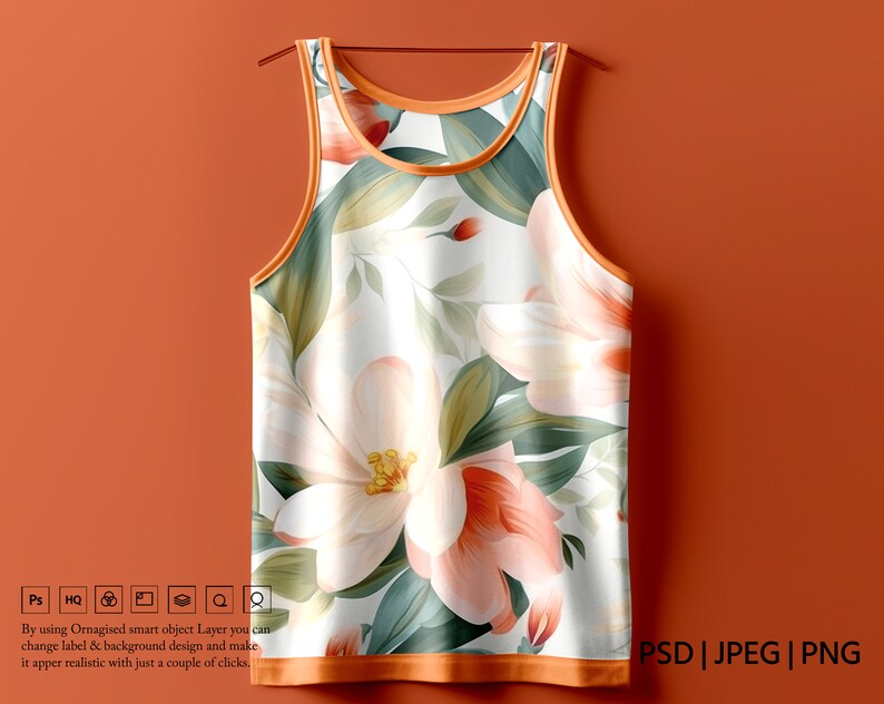 K&ouml;nnte beinhalten: Ein wei&szlig;es Tanktop mit einem Blumendruck mit gro&szlig;en rosa und wei&szlig;en Bl&uuml;ten und gr&uuml;nen Bl&auml;ttern. Das Tanktop hat einen orangefarbenen Saum an Hals und Arml&ouml;chern.