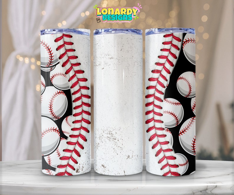 May include: Three stainless steel tumblers with a baseball theme. The tumbler on the left has a black background with white baseballs and red stitching. The tumbler on the right has the same design. The tumbler in the middle is white with a distressed look.