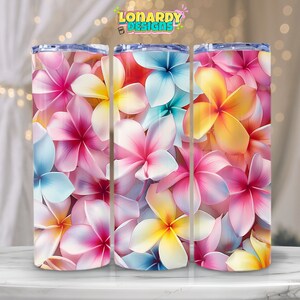 May include: Three stainless steel tumblers with a floral design. The tumblers are covered in a pattern of pink, yellow, and blue flowers.