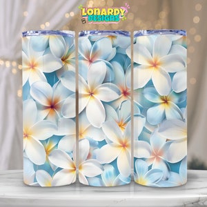 May include: Three stainless steel tumblers with a white floral design. The flowers are white with yellow centers and are arranged on a light blue background.