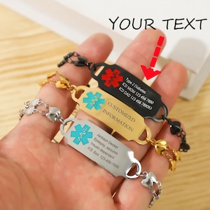 May include: Three medical alert bracelets with different colored bands and engraved information. The top bracelet is black with red text, the middle bracelet is gold with blue text, and the bottom bracelet is silver with blue text. The text on the bracelets includes medical conditions, contact information, and emergency instructions.