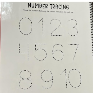 May include: A spiral-bound workbook page with the title "NUMBER TRACING." The page displays numbers 0 through 10 in dotted lines for tracing. The text "Trace the numbers following the correct formation for each one" is above the numbers.