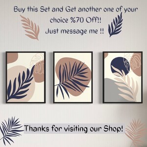 May include: Set of three abstract art prints featuring minimalist botanical illustrations with brown, blue, and grey colours. The prints have a modern and contemporary style.