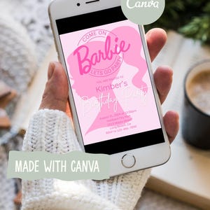 May include: A smartphone displays a pink Barbie-themed birthday party invitation. The invitation includes the text "Come on Barbie, Let's Go Party" and details for Kimber's birthday. The phone is held by a person wearing a white sweater. The Canva logo is visible.