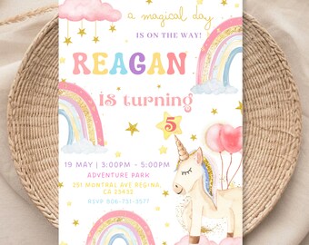 May include: A white invitation with a rainbow, clouds, and a unicorn. The text reads "a magical day is on the way! Reagan is turning 5". The invitation includes details for a birthday party at Adventure Park on May 19th from 3:00 PM to 5:00 PM.