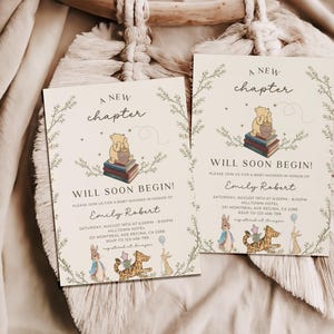 May include: Two Winnie the Pooh themed baby shower invitations with a green leafy border. The invitations feature the text "A new chapter will soon begin!" and a cartoon image of Winnie the Pooh sitting on a stack of books. The invitations also include the text "Please join us for a baby shower in honor of Emily Robert".