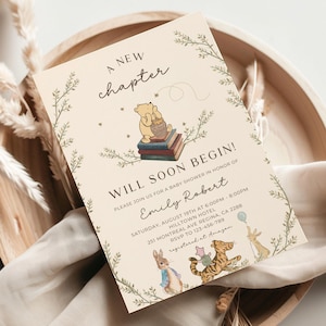 May include: A Winnie the Pooh themed baby shower invitation with a beige background and green foliage. The invitation reads "A New Chapter Will Soon Begin!" and includes the text "Please join us for a baby shower in honor of Emily Robert, Saturday, August 19th at 6:00pm - 8:00pm, Hilltown Hotel, 251 Montreal Ave Regina, CA 2288, RSVP to 123-456-789, registered at Amazon."