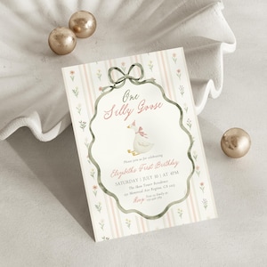 May include: A whimsical invitation for a first birthday celebration. The design features a cartoon goose wearing a party hat, framed by a decorative border and bow. The invitation includes the text "One Silly Goose" and event details.