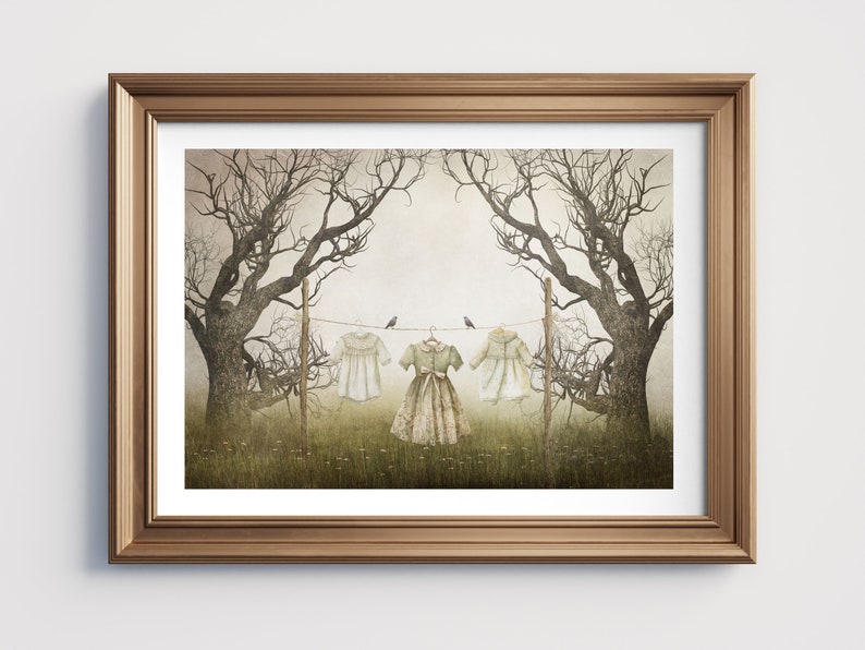 May include: A framed illustration of three white dresses hanging on a clothesline between two bare trees. The dresses are in a field with green grass and wildflowers. Two small birds are perched on the clothesline.