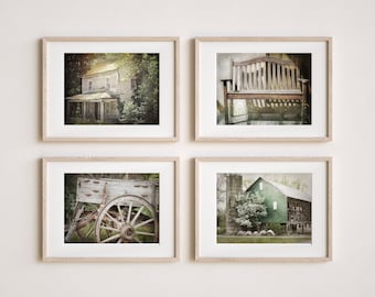 May include: A set of four framed vintage photographs featuring rustic scenes. The first image shows a weathered wooden house with overgrown greenery. The second image shows a wooden bench with a weathered finish. The third image shows a wooden wagon wheel. The fourth image shows a green barn with a white door and a tree in the foreground.