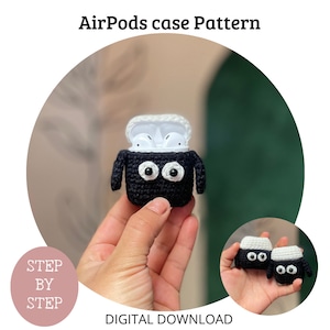 May include: Crochet pattern for an AirPods case shaped like a sheep. The case is black with white eyes and a white top. The pattern is a digital download and includes step-by-step instructions. "Step by Step" is written on a pink circle.