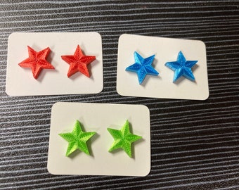 Star shaped earrings ,perfect for 4th of July celebrations! Titanium hypoallergenic stud post, star-burst design, red, white
