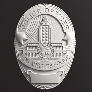 May include: A white Los Angeles Police Officer badge. The text "POLICE OFFICER" is at the top and "LOS ANGELES POLICE" at the bottom. The badge features a building and star accents.