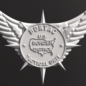May include: A white emblem featuring the text "BORTAC U.S. BORDER PATROL TACTICAL UNIT" around a map of the United States. The emblem is surrounded by wings and star-shaped points.