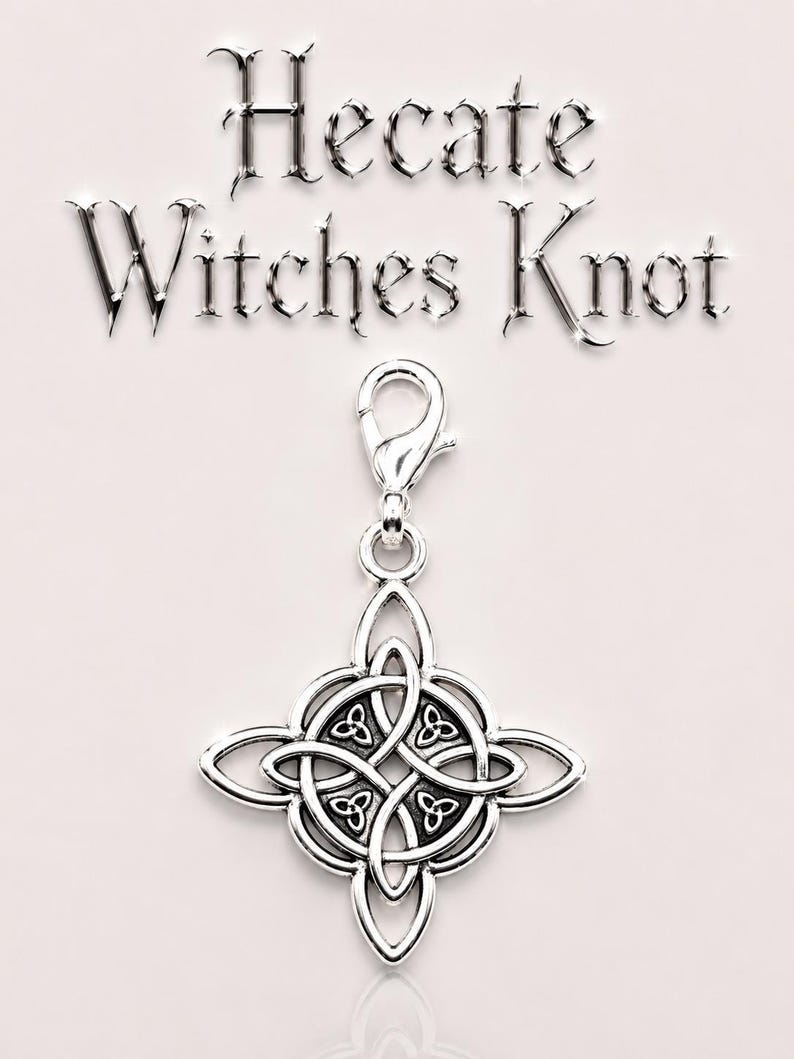 May include: A silver-colored charm with a Celtic knot design, featuring a lobster clasp for attachment. The charm is in the shape of a four-pointed star with an intricate knot pattern at the center. The words "Hecate Witches Knot" are above the charm.