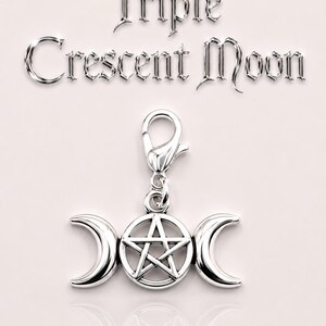 May include: A silver-colored charm featuring a triple crescent moon design with a pentagram in the center. The charm is attached to a clasp. The words "Triple Crescent Moon" are displayed above the charm.