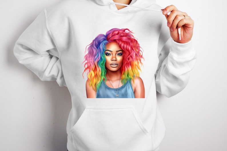 May include: A white hoodie with a colorful illustration of a woman with rainbow hair. The woman is wearing a blue tank top and a silver necklace.