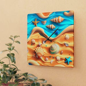 May include: A square wall clock featuring a vibrant beach scene with golden sand, turquoise water, and various seashells and starfish scattered across the surface. The clock has black hands centred on the design, indicating the time.
