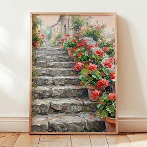 Puede incluir: Pintura al óleo enmarcada que representa una escalera de piedra que conduce a un edificio. Geranios rojos en macetas de terracota bordean los escalones y las paredes. La obra de arte tiene una paleta de colores cálidos, con un enfoque en las flores y la arquitectura.