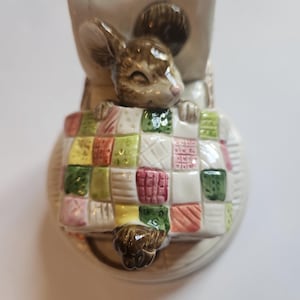 May include: A rustic wooden sign with the text "Welcome to our home" in white lettering. The sign features a distressed finish and a simple, inviting design, perfect for front door decor.