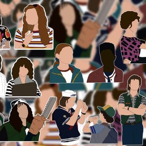 May include: A set of 12 colorful cartoon stickers featuring characters from the popular TV show Stranger Things. The stickers are printed on high-quality vinyl and are perfect for decorating laptops, water bottles, notebooks, and more.