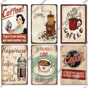 May include: Six vintage-style metal signs with coffee-themed illustrations and text. The signs feature images of a coffee grinder, a cup of coffee, a french press, and a coffee mug. The text on the signs includes phrases like "Coffee!" and "Happiness is a cup of coffee and a really good book."
