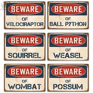 May include: Six vintage-style metal signs with a distressed look. Each sign has a red oval with the word "BEWARE" in white text. Below the oval, each sign has a different animal name in white text. The animals are Velociraptor, Ball Python, Squirrel, Weasel, Wombat, and Possum.