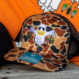 Remi Duck Hunting Ghost - Embroidered Old School Orange Camo Trucker Hat/Cap