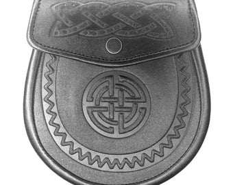 May include: Black leather sporran with Celtic knotwork design. The sporran features a flap closure with a decorative embossed knot pattern and a central embossed Celtic knot. The bottom edge has a decorative zig-zag pattern.