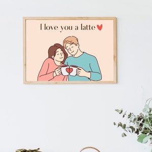 May include: A framed illustration of a couple holding coffee mugs with a heart on them. The text "I love you a latte" is above the couple. The background is a light pink color.